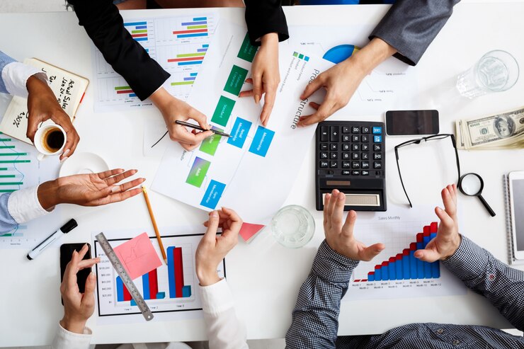 businessmen-hands-white-table-with-documents-drafts_176420-357